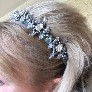 Tiara of crystals of different shapes and sizes.